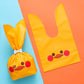 Cartoon rabbit ears gift packaging bag, yellow with cute animal face print