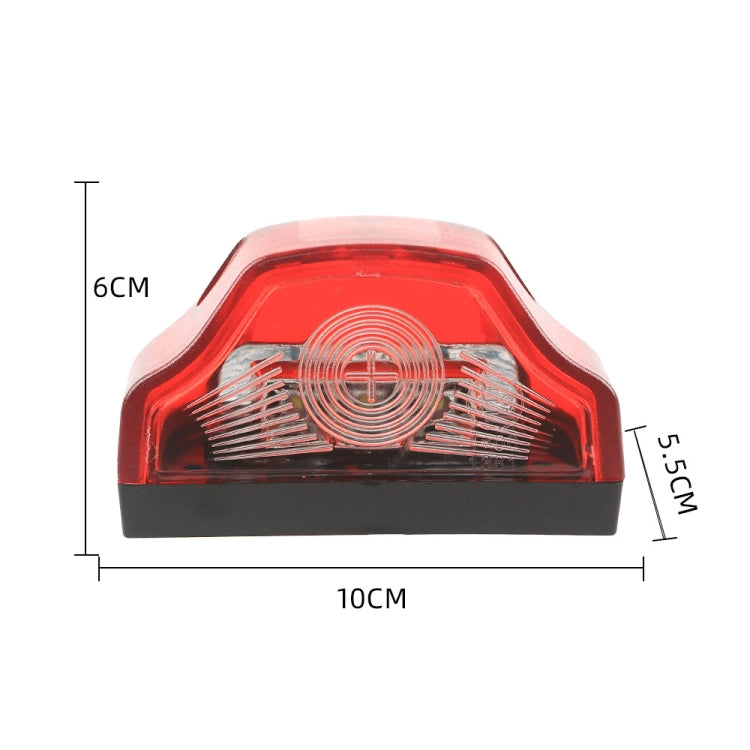 Front view of a red LED license plate lamp with black base and clear lens insert