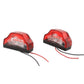 Two red LED license plate lamps with black base and clear lens insert, with wire leads