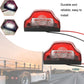 Pair of red LED license plate lamps with black base, clear lens insert, and attached wire leads