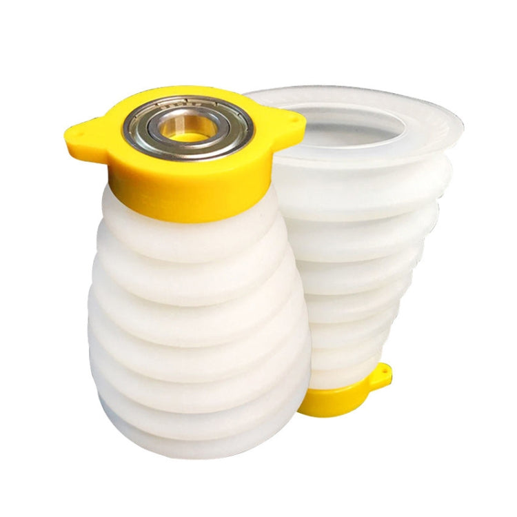 White accordion silicone dust cover with yellow base and metal drill-bit opening