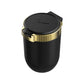 Car ashtray with hinged cover, black body and gold ring, covered top with icon