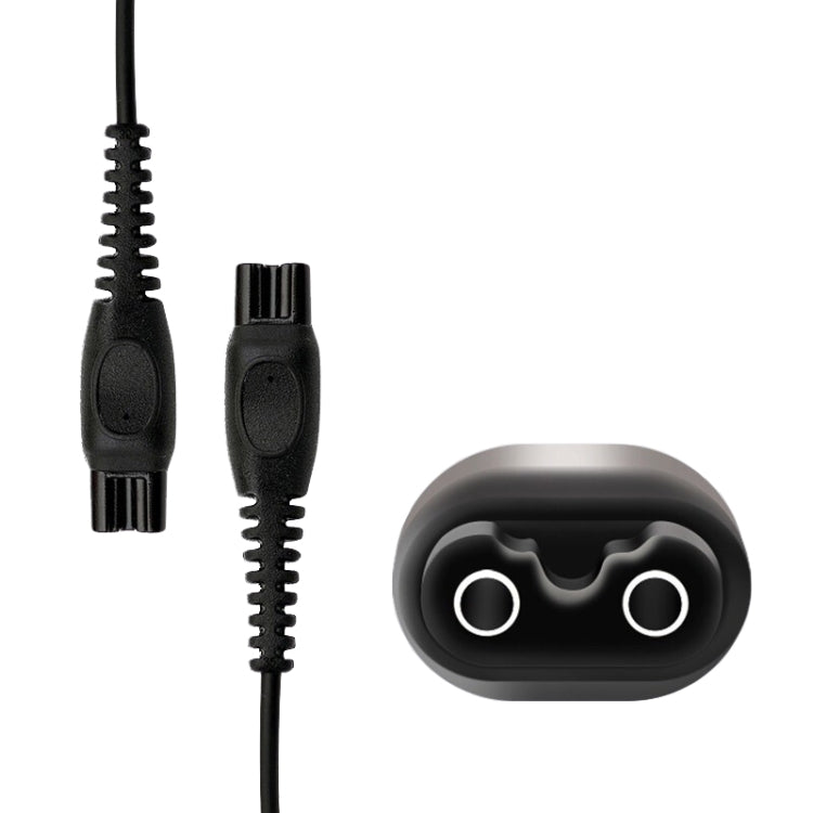 Pair of black charger connectors with prongs and cable for shaver charging