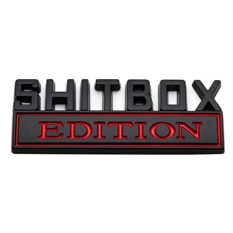 Rear car badge plate with black SHITBOX letters and red EDITION lettering