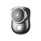 Electric mini shaver with round mesh head and power button, black