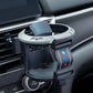 Car cup holder accessory, angled view, green ring with black base and controls