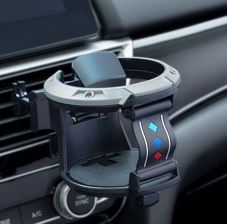 Car cup holder accessory, angled view, green ring with black base and controls