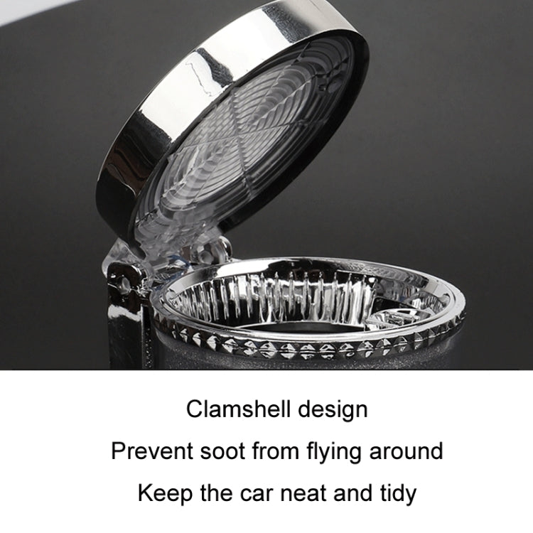 Chrome car ashtray with open clamshell lid and ridged inner tray