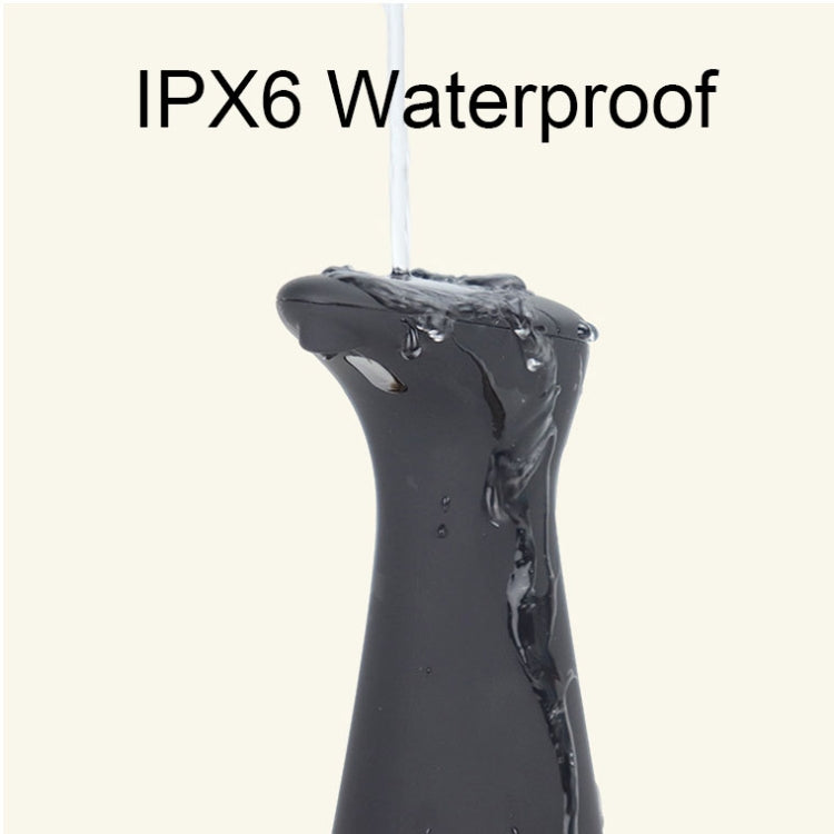 Black waterproof automatic soap dispenser with water droplets on the top nozzle