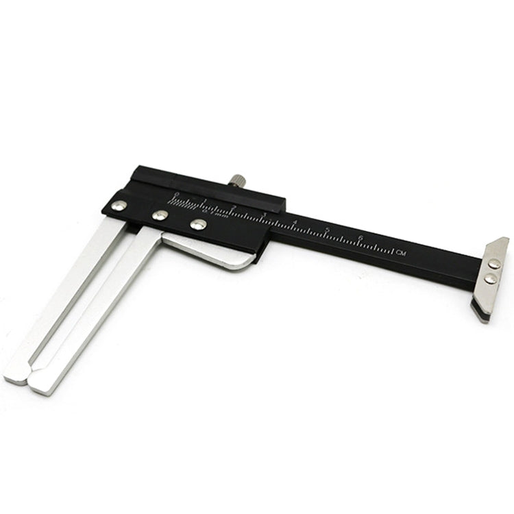 Black tire tread depth gauge caliper with silver arms and metric measurement scale