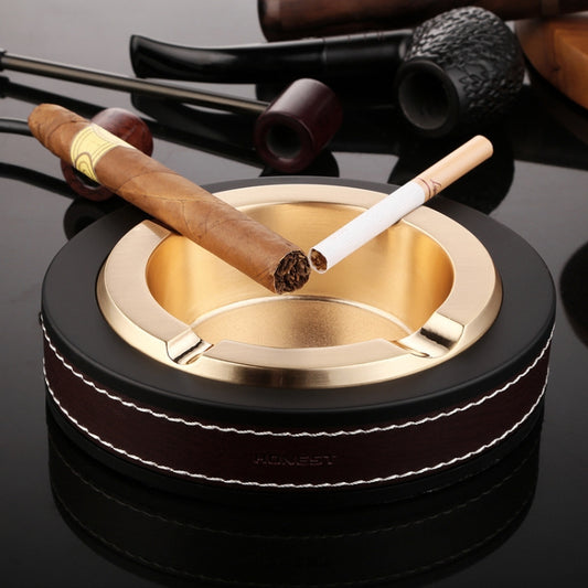 Black and gold metal cigar ashtray with leather band, cigar rest slots, and tray center