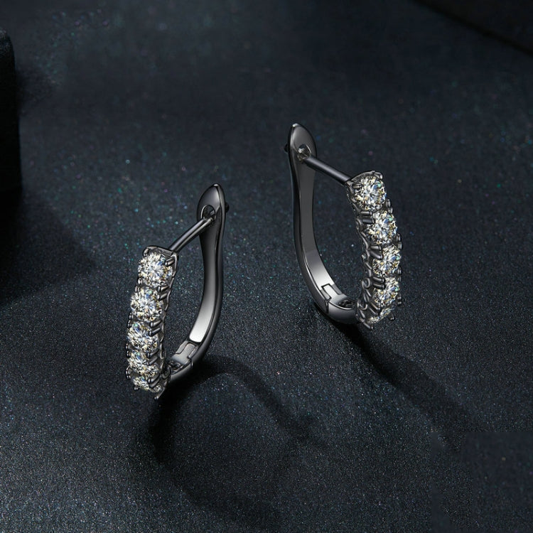 Silver U-shaped hoop earrings with scalloped settings and stacked clear stones