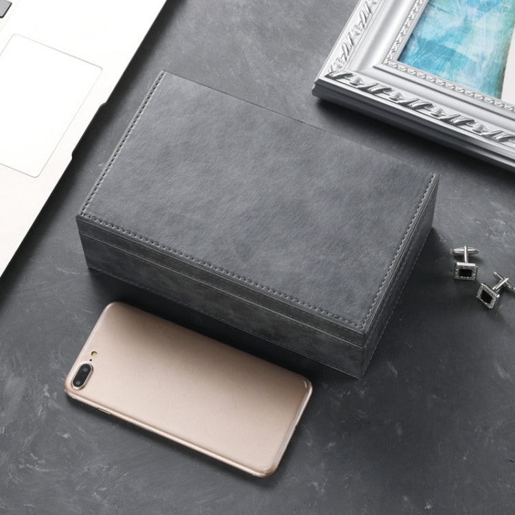 Dark gray phone shielding box with top flap open, phone resting inside