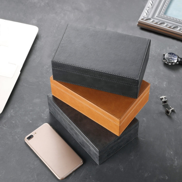 Dark gray and orange phone shielding boxes with stitched hinged flap