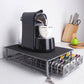 3-row coffee capsule drawer under coffee machine with black top and silver wire base