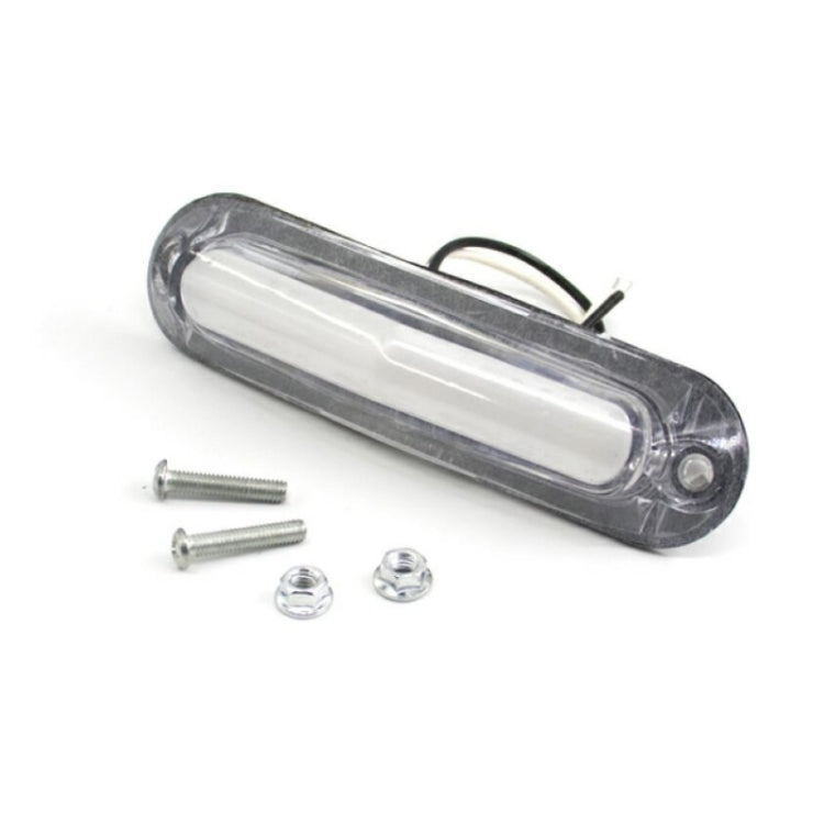 Clear-lens LED side marker light with two mounting screws and wire leads