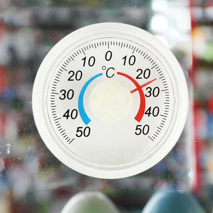 Round plastic thermometer with °C scale and blue/red temperature indicator arcs