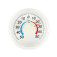 Circular plastic thermometer face with °C markings and blue/red temperature indicators