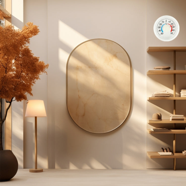 Small round wall thermometer with °C dial and colored indicator ring