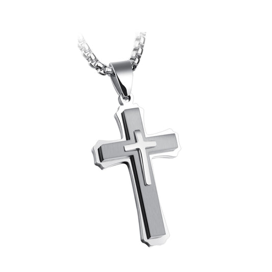 Silver-tone cross pendant necklace with three-link chain layering, glossy black center detail