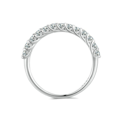 Silver ring with arched band and row of small round stones along the top