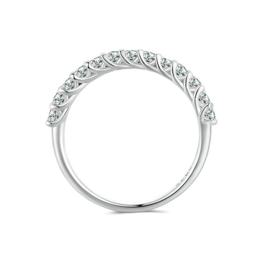 Silver ring with arched band and row of small round stones along the top