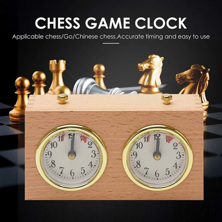 Wood chess game clock with two analog dials in a gold-tone body