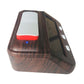 Wood-grain digital chess clock side view with red button strip and blue indicator light
