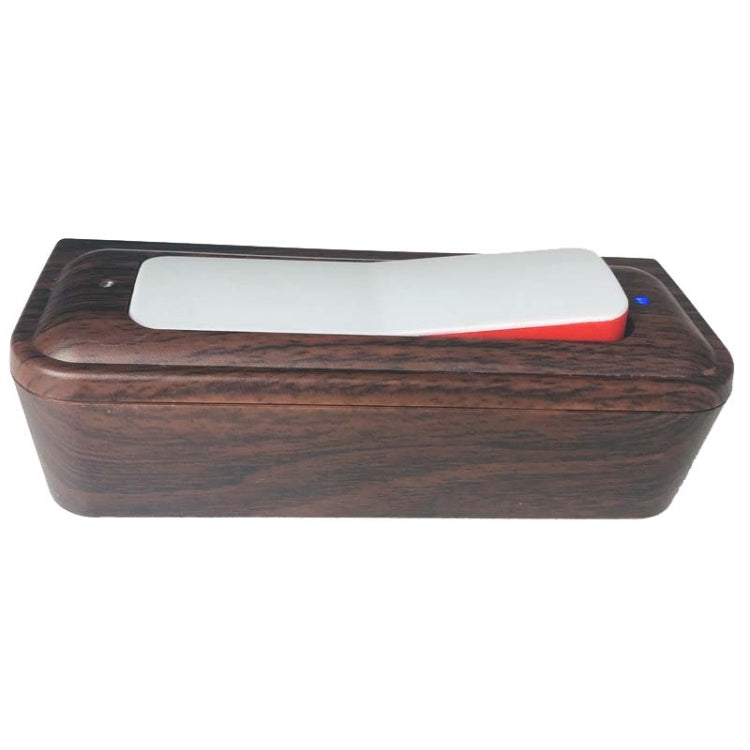 Wood-grain digital chess clock top view with white display window and red edge bar