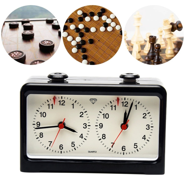 Black chess and go timer with two clock dials, quartz markings, and red hands