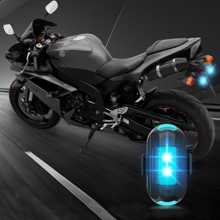 Blue glowing motorcycle magnetic warning flash light attached under the bike