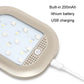 Beige magnetic LED reading light close-up with USB charging cable and vented speaker area