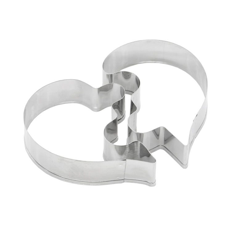 Heart-shaped metal puzzle biscuit mold pieces in a two-part interlock shape
