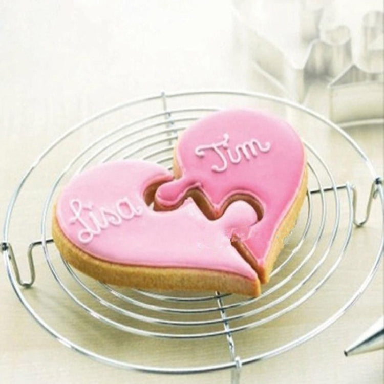 Heart-shaped pink biscuit with puzzle-style cutout on top