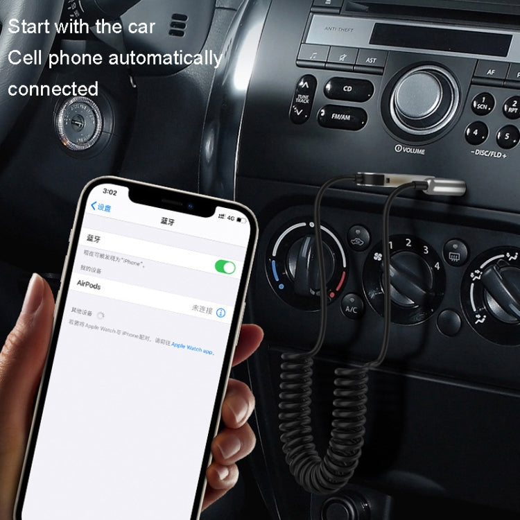 Bluetooth car AUX audio receiver adapter plugged into stereo with phone connected