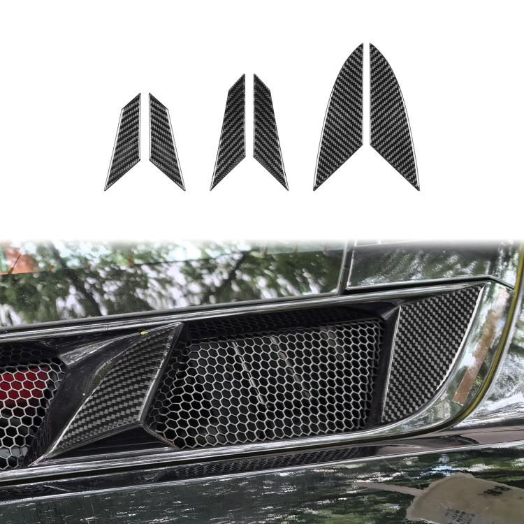 Installed carbon fiber-pattern air vent trim stickers on front grille, three pieces visible