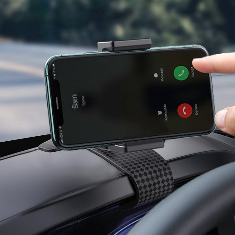 Black car phone holder holding a smartphone on a textured dashboard mount
