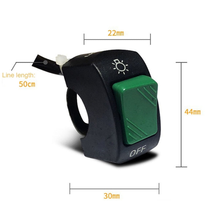 Black switch housing with green rocker, sun icon, and wiring line