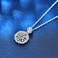 Silver chain necklace featuring a round moissanite-style flower pendant