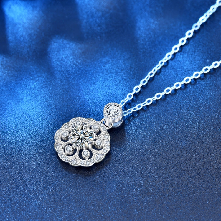Silver chain necklace featuring a round moissanite-style flower pendant