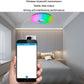 RGB LED ceiling lamp glowing overhead, controlled via smartphone app on mobile