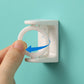 White adhesive rotary ring hook, hand pressing to attach on square base
