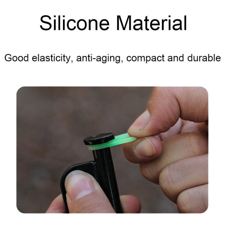 Flexible silicone reflective ring in mint green, held on a black stake
