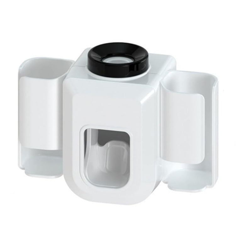 White electric toothpaste squeezer with central tube squeezing chamber and two side cups