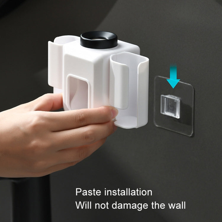 White wall-mounted toothpaste squeezer with removable installation pad and secure mounting