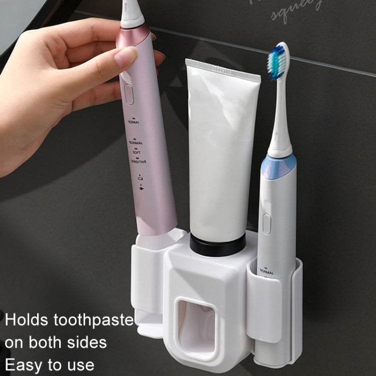 Wall-mounted toothpaste squeezer unit with side toothbrush holders and tube squeezing cradle