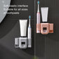 Toothpaste squeezer wall mount in white and orange with two toothbrush cups and tube cradle