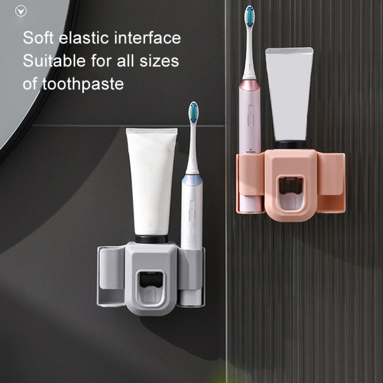 Toothpaste squeezer wall mount in white and orange with two toothbrush cups and tube cradle