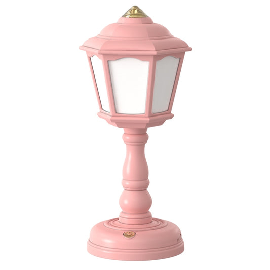 Pink retro table lamp with lantern-style shade and gold top cap.
