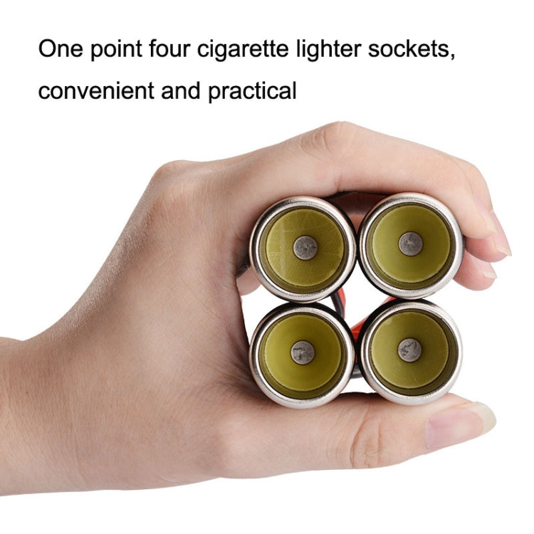 Car 4-hole cigarette lighter sockets with four yellow-topped ports held in a hand